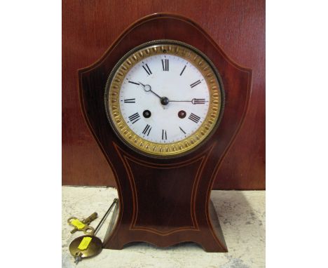 Edwardian inlaid mahogany balloon shaped two train mantel clock with French brass movement striking on one bell.