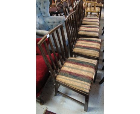 Set of four oak stick back dining chairs with stuff over seats. (4)