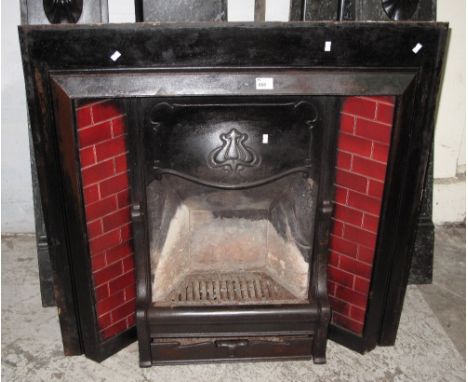 Art Nouveau cast iron fireplace with marble surround.