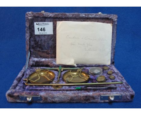 Cased set of brass scales and weights together with two Carte de Visite portrait photographs.