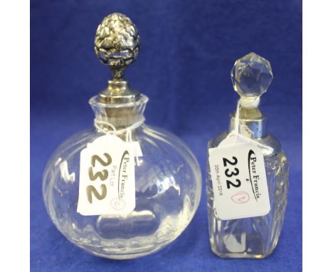 Glass scent bottle with white metal pineapple type finial stopper, marked: Christian Dior together with glass silver collared