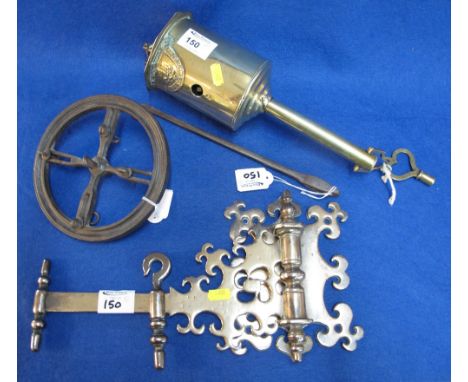 A John Linwood brass bottle jack with hinged wall bracket, key and under frame together with an iron hook. (4)