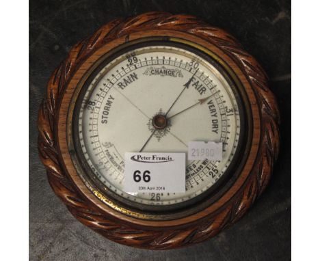 Small oak cased aneroid barometer.
