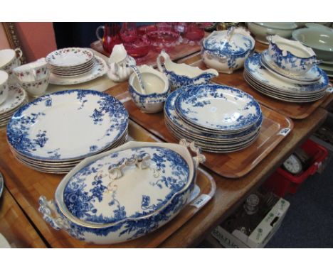 Three trays of 19th Century blue and white transfer printed foliate Stoke Pottery dinnerware items comprising: lidded tureens