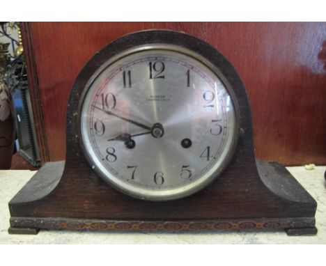 Mid Century oak hat shaped two train mantel clock, the face marked: Morecom Carmarthen.