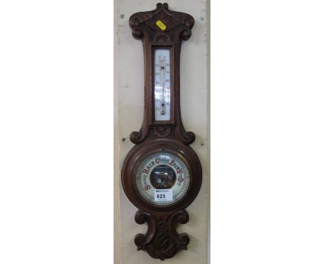 20th Century carved oak, enamelled barometer.