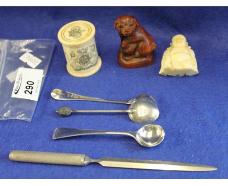 Oriental wooden Netsuke in the form of a dog, a carved, seated Buddha, probably plastic, and a carved bone armorial cylinder 
