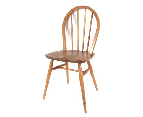 A pair of Ercol stick back kitchen chairs