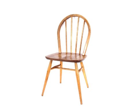 A set of four Ercol stick back dining chairs