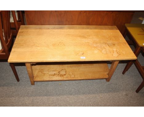 A 20th Century light oak two tier coffee table, 112cm wide x 56cm deep x 46cm high