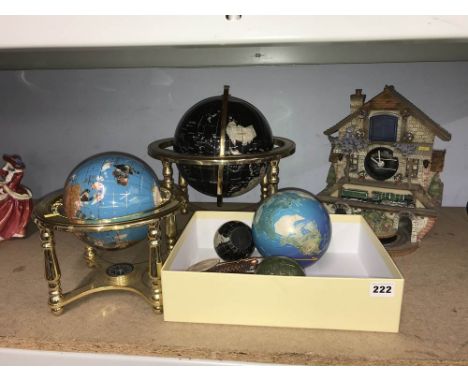 Four globes and a clock