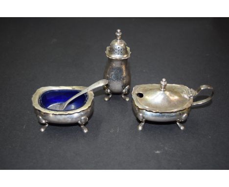 A silver three piece cruet set, by Barker Ellis Silver Co, Birmingham 1966, with one spoon, 112g.