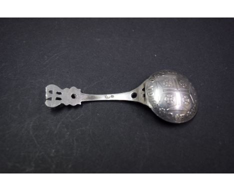 A continental caddy spoon, the bowl formed from a Portuguese 1750 four hundred escudos.