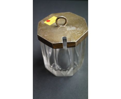 A silver lidded octagonal cut glass preserve jar, by Henry Hodson Plant, London 1939, 115cm, with matching spoon, 100g. Condi