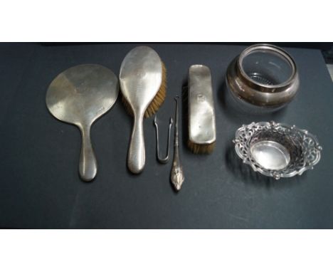 An engine turned dressing set, by S & P, Birmingham 1925, comprising two hair brushed and one hand mirror; together with a pa