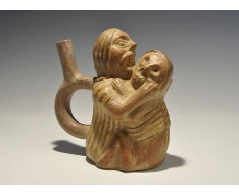 "20th century AD. A glazed ceramic stirrup vessel formed as a long-haired figure with gaping mouth and exposed teeth gripping