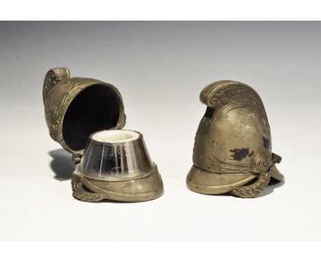 "19th century AD. A matched pair of brass model cuirassier helmets, each with hinged upper section and conical inner flange t