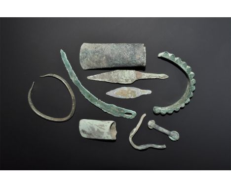 "2nd millennium BC and later. A mixed group of bronze items comprising: a gouge with lateral flanges forming the socket; a ho