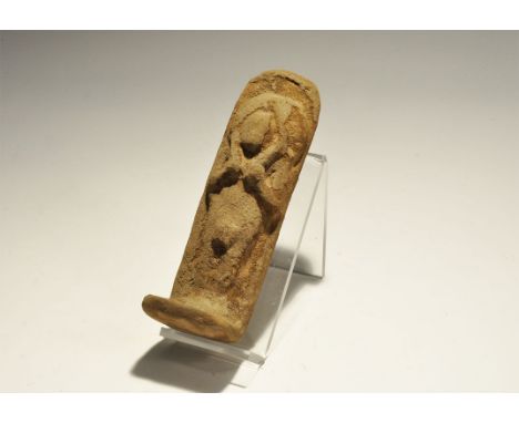 "19th-20th century AD. A ceramic shabti with arms to the chest holding implements, plaque to the rear and rectangular base. 2