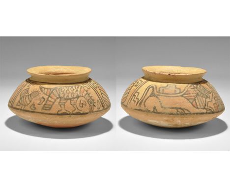 "3300-1700 BC. A squat terracotta jar with flared rim, polychrome panels of a crouching lion, a peepal leaf, two birds and ge