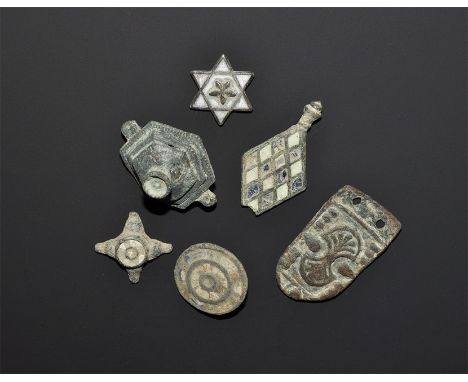 "2nd-9th century AD. A mixed group of bronze items comprising: a discoid stud with concentric rings of polychrome enamel;a lo