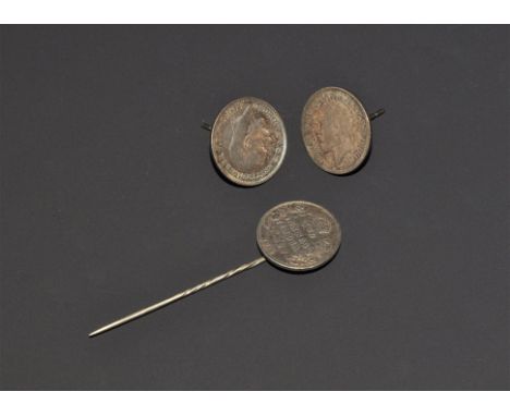 "20th century AD. A group comprising: a stick pin mounted with an India two annas coin of Edward VII (1910); a pair of stud e