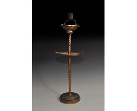 "20th century AD. A tall copper smoker's stand with circular base, twisted column, with circular tray at mid height with circ