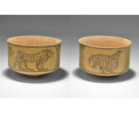 "3300-1700 BC. A terracotta cup with scene of two standing lions and another of a bird. 80 grams, 87mm (3 1/2"). See Satyawad
