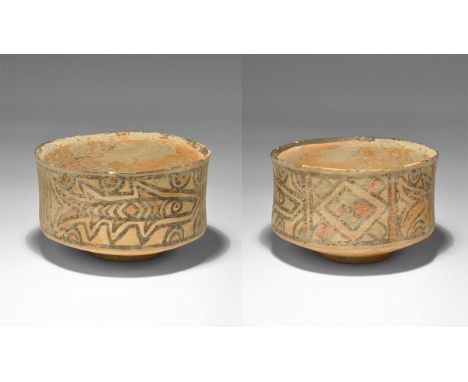 "3300-1700 BC. A carinated terracotta cup with polychrome panels of fish and geometric ornament. 93 grams, 90mm (3 1/2"). See