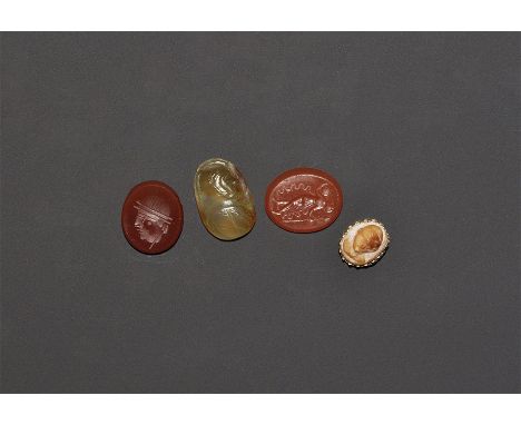 "17th century AD and later. A mixed group of Roman design carnelian intaglios and a cameo comprising: a profile male bust wit