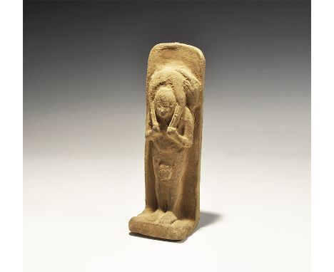 "20th century AD. A ceramic statuette of a standing figure carrying a goat across his shoulders; dorsal plaque and square bas