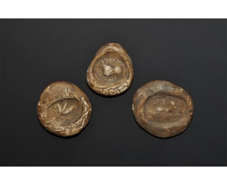 "19th-20th century AD. A mixed group of seal impressions in ceramic, with winged horse, running wolf and hound motifs. 22 gra