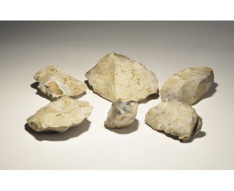 "Mesolithic, 18000-8000 BC. Group comprising: a heavy 'Thames Pick' type axe; three cleavers formed on heavy flakes; a heavy 