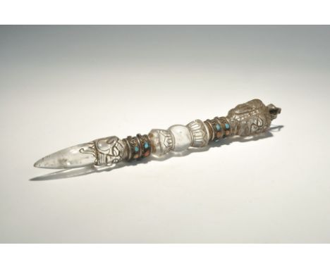 "20th century AD. A quartz ritual stake with three carved faces to the top, white metal collars with inset turquoise and red 