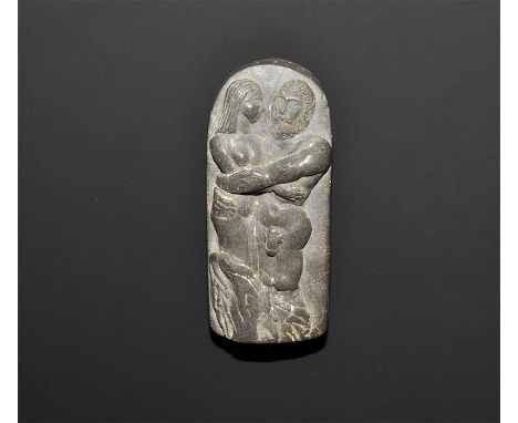 "20th century AD. A ceramic tongue-shaped stele with high-relief image of a nude male embracing a female. 61 grams, 74mm (3")