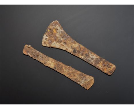 "5th-1st century BC. A pair of Central European iron flat-axe blades, one flat-section with slightly flared edge, scooped rea