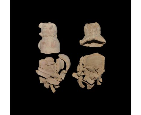"20th century AD. A matched pair of ceramic idols in fragments, each with bulbous body and applied facial details. 1.5kg, 0.5
