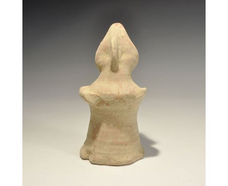 "20th century AD. A bell-shaped ceramic figurine with lozengiform head; applied arms and facial details. 606 grams, 19.5cm (7