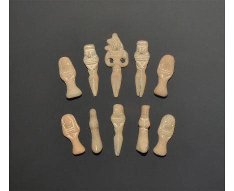 ". A mixed group of miniature ceramic idols comprising: two in kneeling pose; four recumbent, arms to the midriff; four model