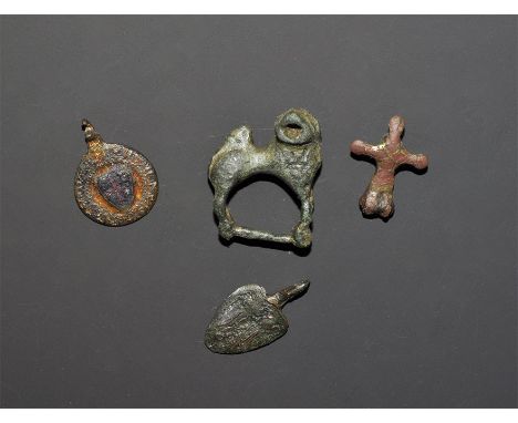 "13th-14th century AD. A mixed group of bronze items comprising: a buckle loop formed as a dog with head turned, mouth open; 