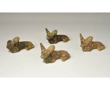 . A mixed group of undated archaistic ceramic bull figurines, each with painted geometric designs. 677 grams total, 10.5cm (4