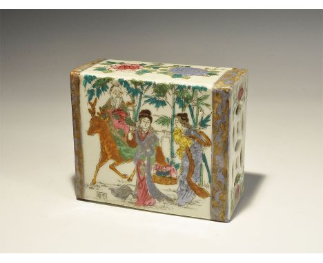 "19th-early 20th century AD. A white-glazed ceramic rectangular box with slot to the underside and openwork pattern to the up