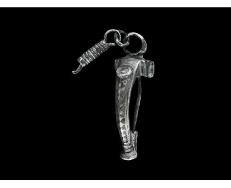 "1st-2nd century AD. A T-shaped bow brooch with integral loop and discoid plaque with reserved pellet, thick bow and arms wit