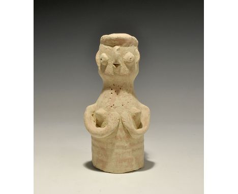 "3300-1300 BC. A bell-shaped ceramic figurine with globular head; applied arms supporting the breasts, applied facial details