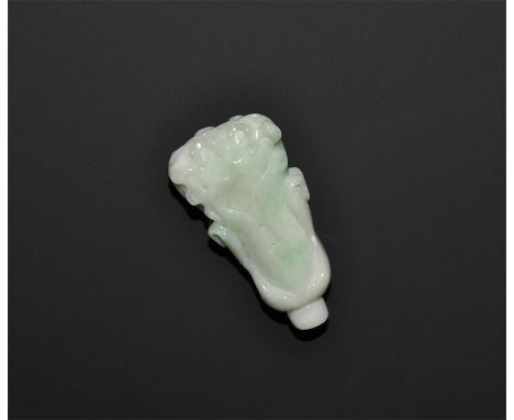 "20th century AD. A carved green jade flower pendant, the stalk pierced for suspension. 25 grams, 46mm (1 3/4"). UK art marke