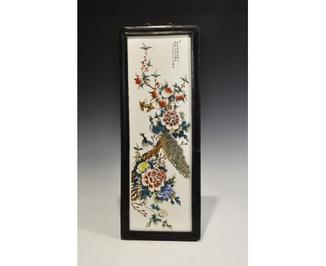 "20th century AD. A glazed ceramic panel with enamelled design of a peacock and peahen on a branch with foliage and flowers; 
