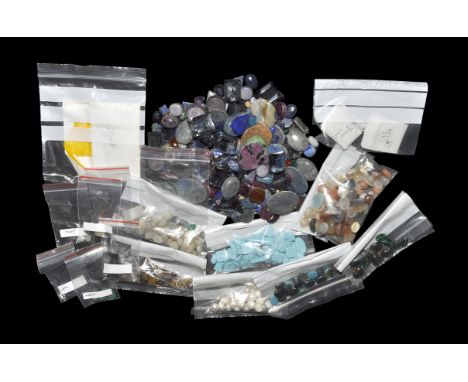 ". A quantity of cut gemstones comprising: pearl, black star sapphire, lapis lazuli, tiger eye, moonstone, turquoise, agate, 