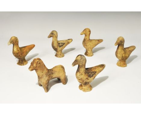 ". A mixed group of undated archaistic ceramic figurines, five birds on conical bases and one horse; black painted designs. 1