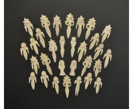 ". A mixed group of undated archaistic ceramic figures, two with discoid base, twenty-eight reclining females with flat back.