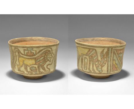 "3300-1700 BC. A terracotta cup with slightly waisted sidewall, polychrome geometric panels with a lion and antelope. 76 gram
